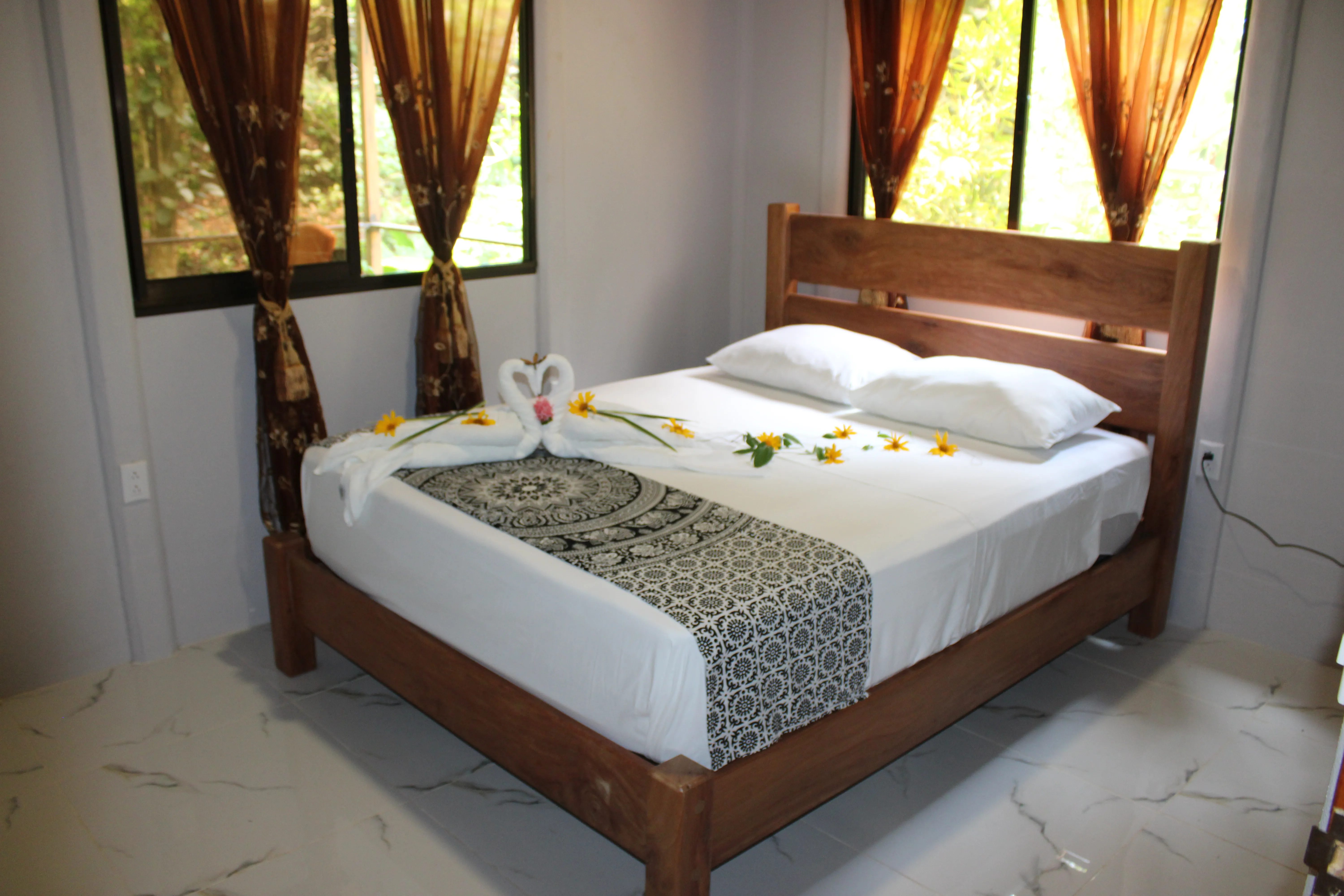 the cozy queen bed of the casita room